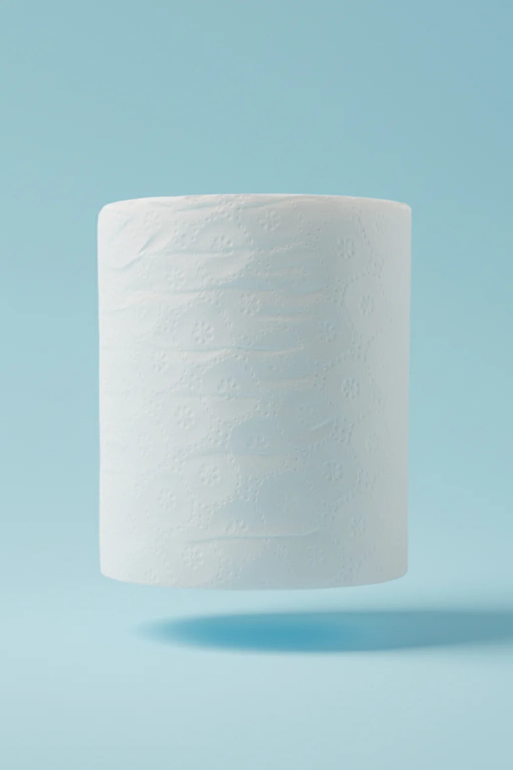 White roll of autocut tissue paper on a light blue background