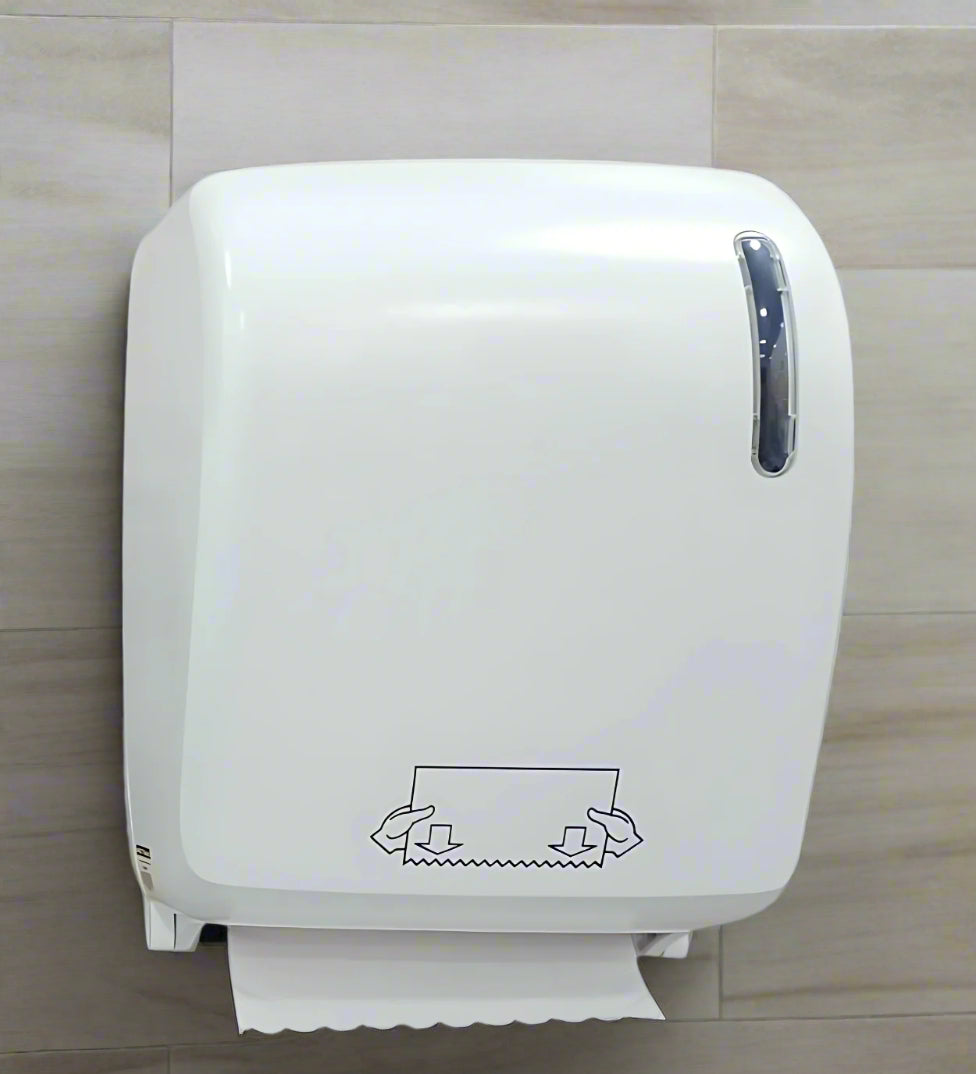 White paper towel dispenser on a gray background